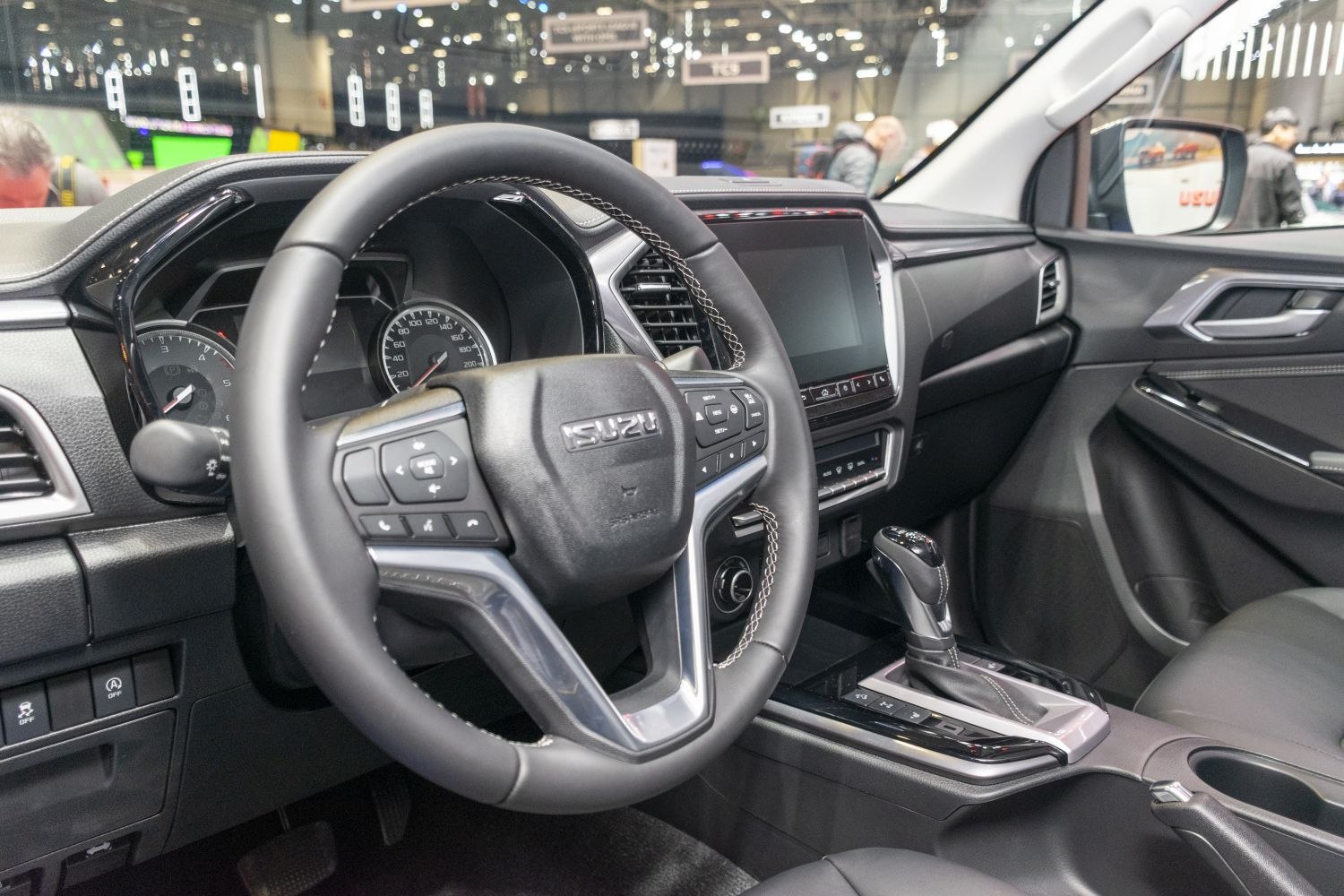 Steering wheel with controls, digital dashboard, touchscreen infotainment