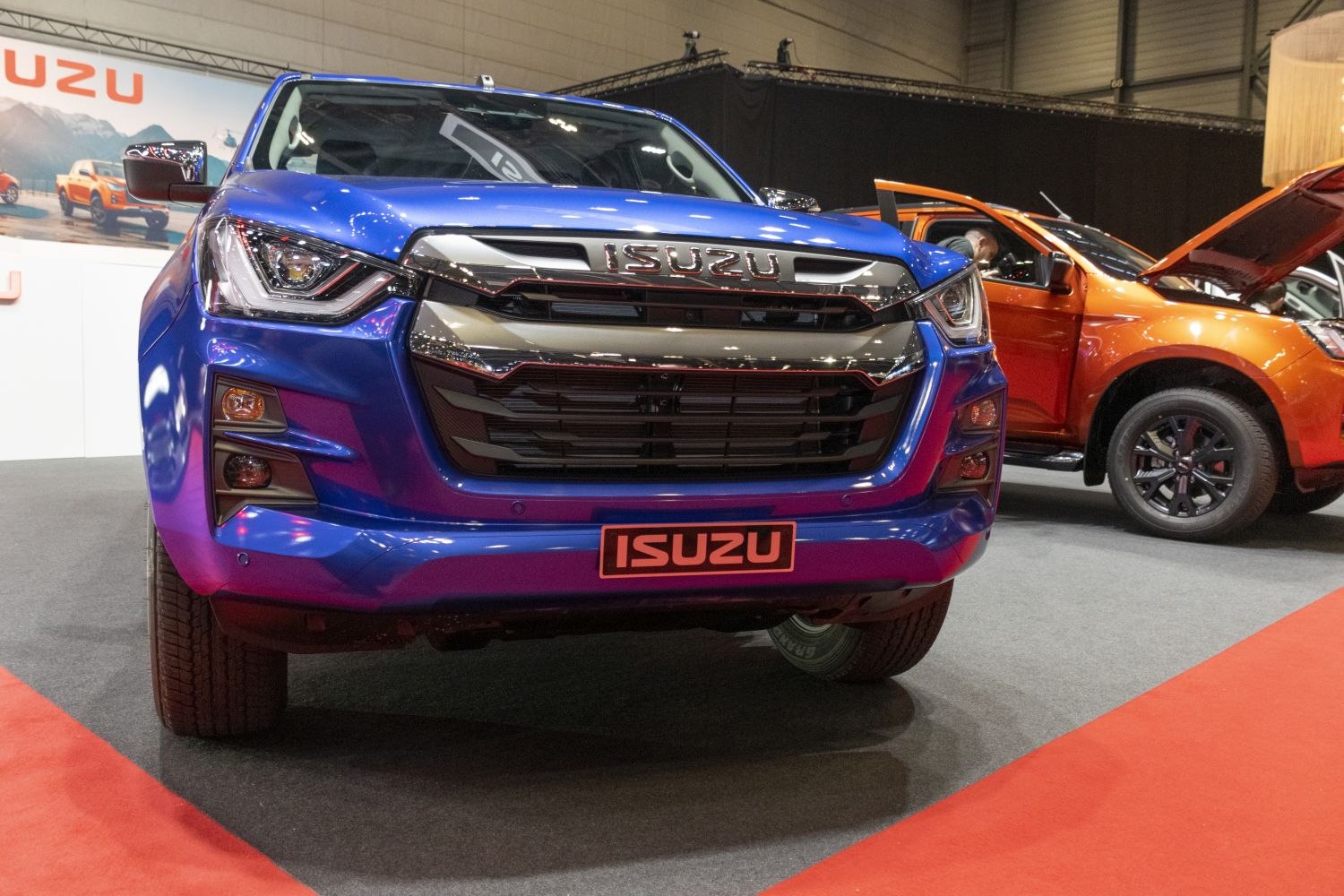 Blue pickup front view with grille and headlights