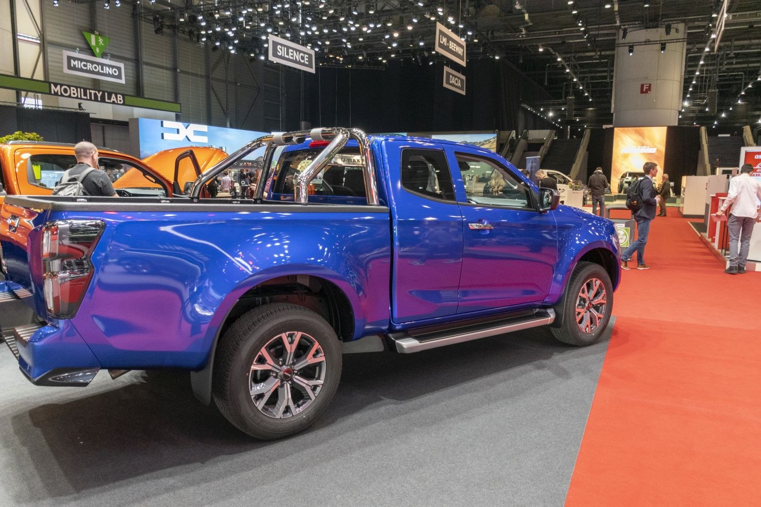Blue extended cab pickup truck with polished metal sports bar