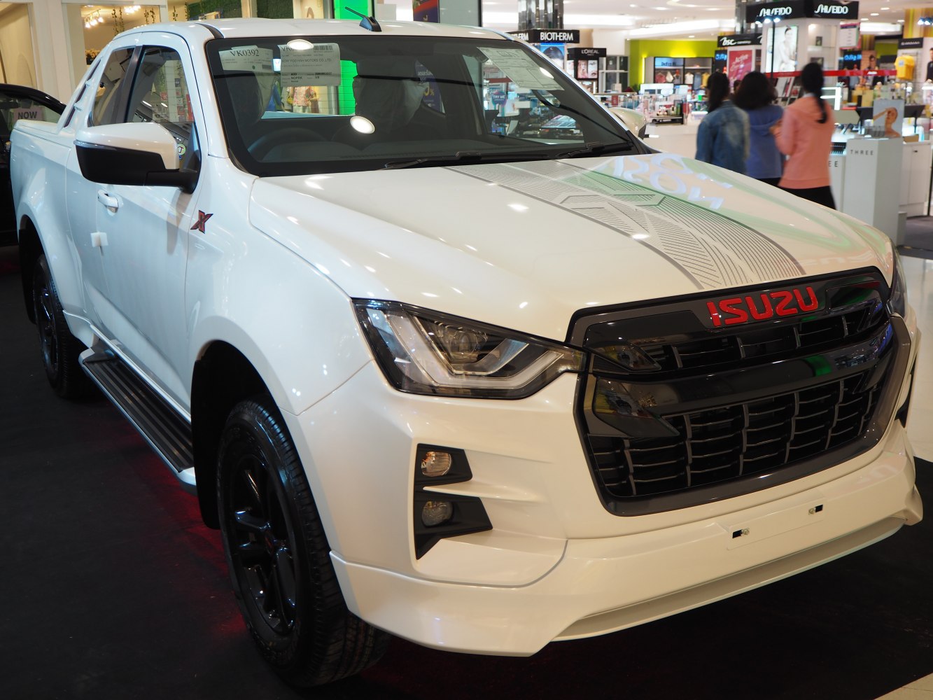 Front grille and LED headlights of a white pickup truck.