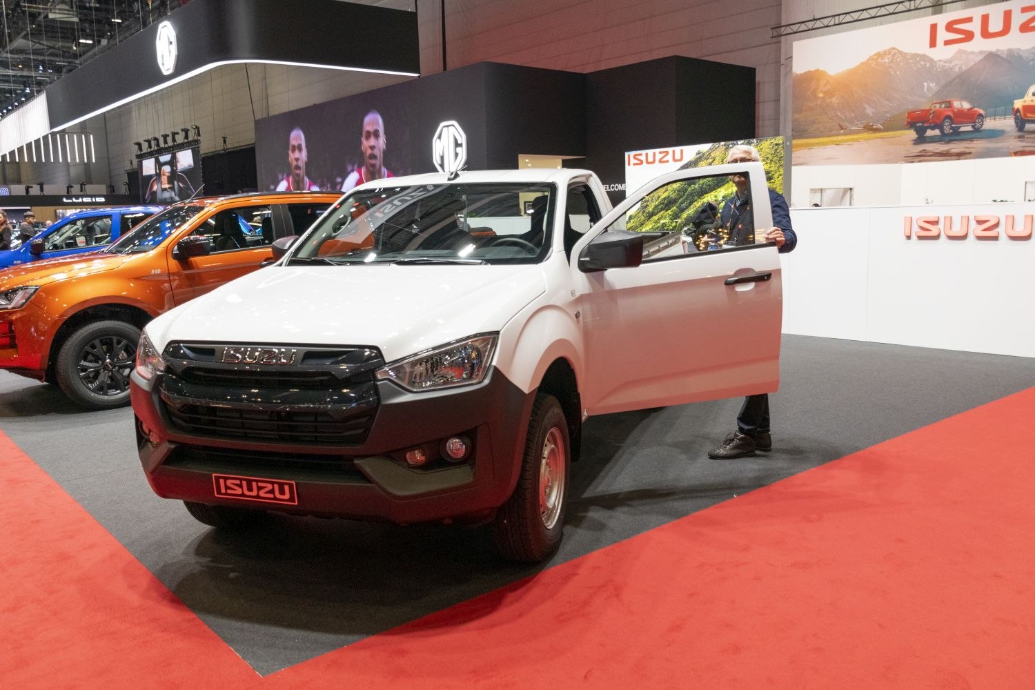 Front and side view of pickup truck with open door