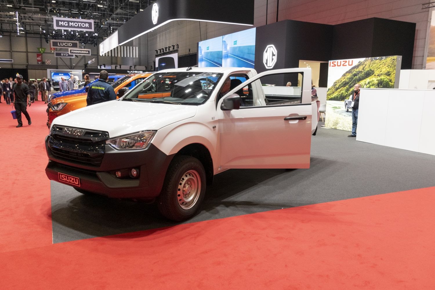 White single cab pickup truck with black grille and open driver door