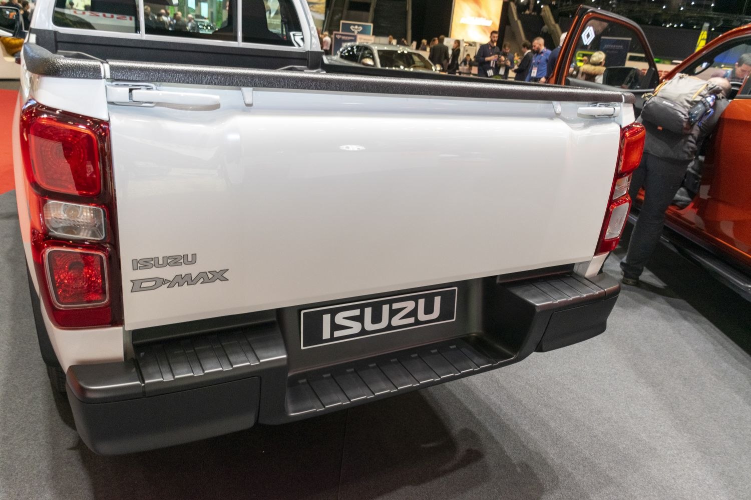Tailgate and rear light cluster of a white pickup truck