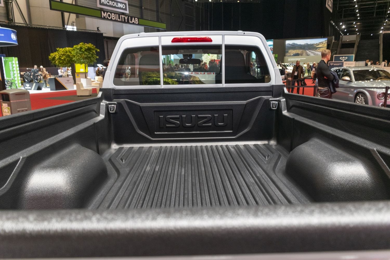 Durable truck bed liner and rear cabin window in single cab pickup