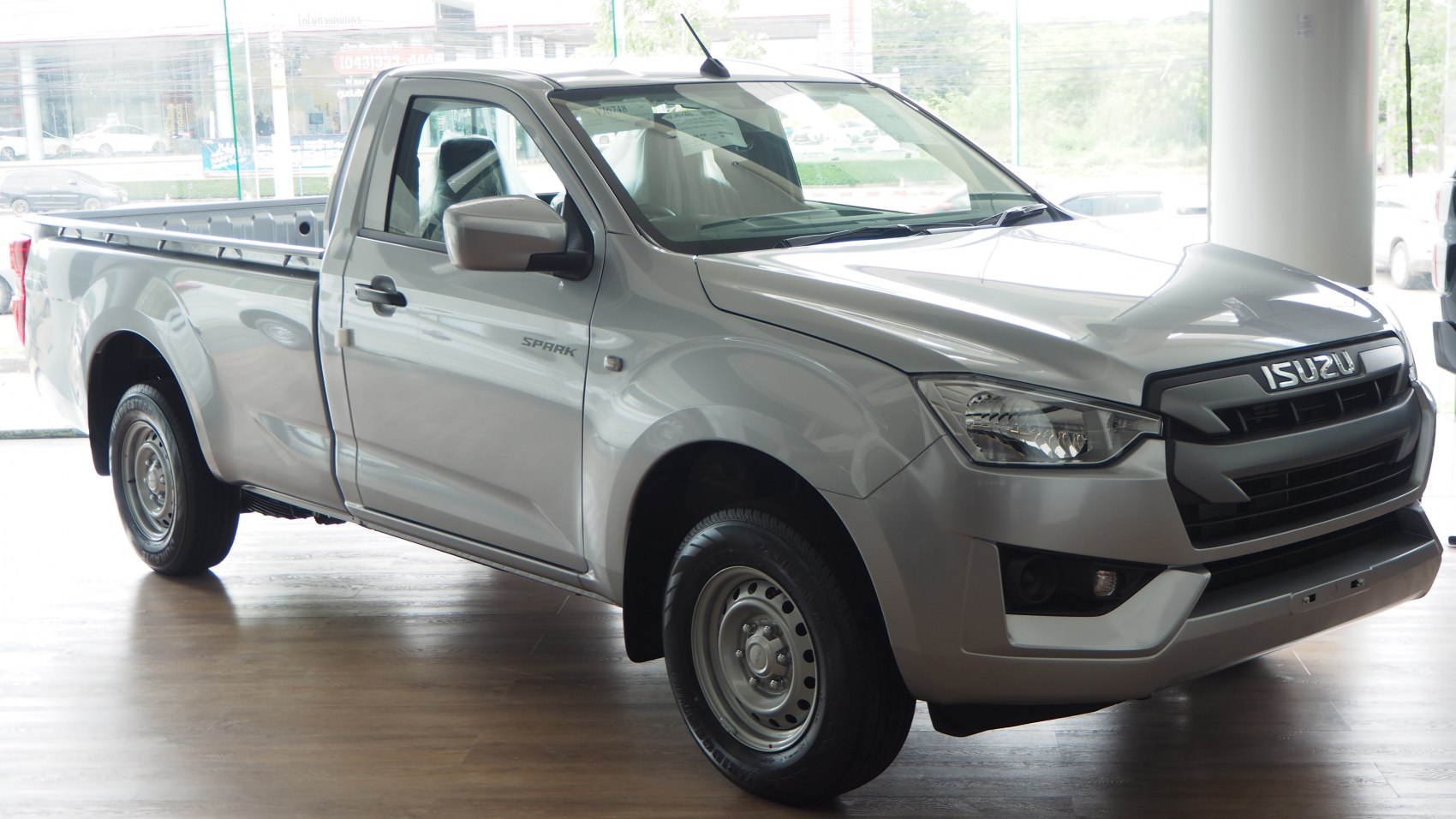 Silver single cab pickup truck front and side view