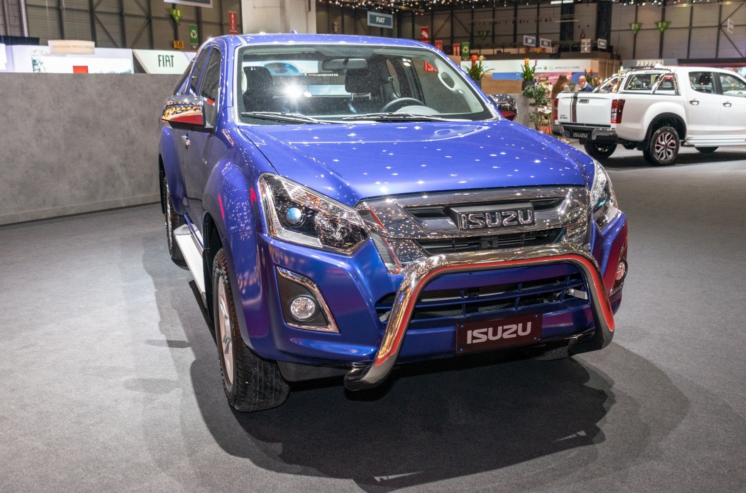 Blue pickup front view with chrome bull bar and detailed headlights