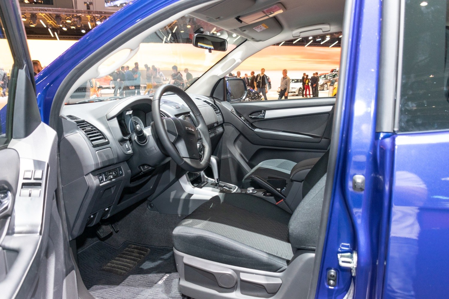Driver side cabin interior with dashboard and open door