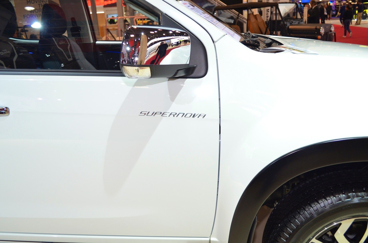 Side mirror with indicator and 'Supernova' badge on pickup door