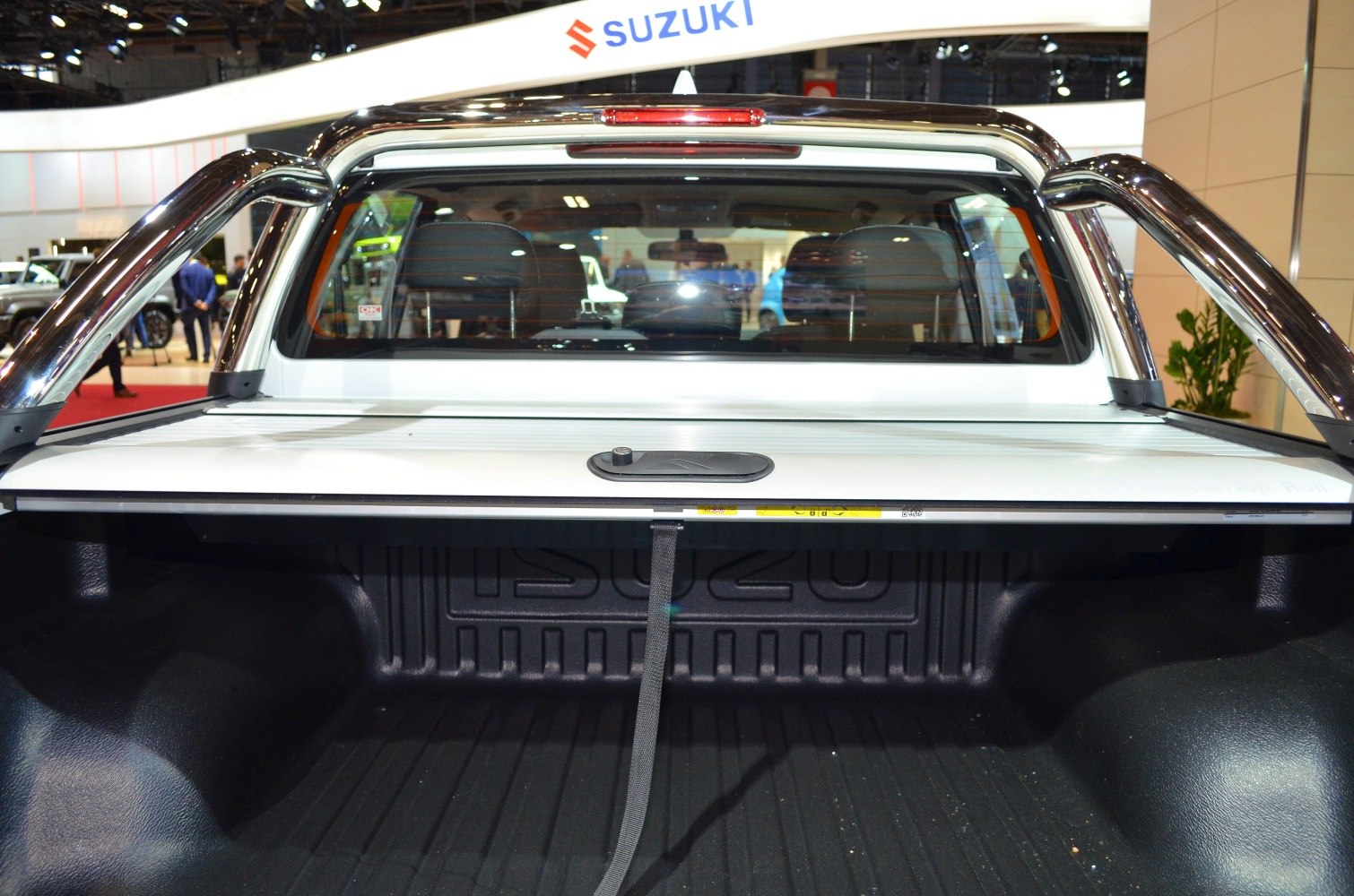 Pickup truck bed with roll cover and chrome sport bars