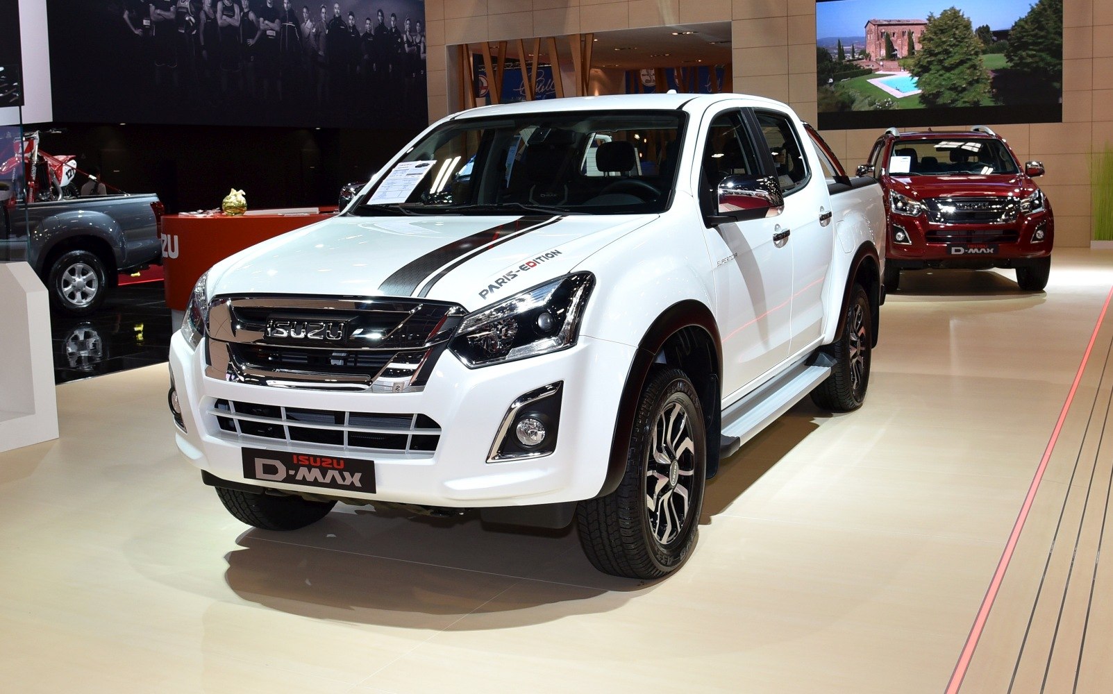 Front view of white pickup with sporty decal and chrome grille