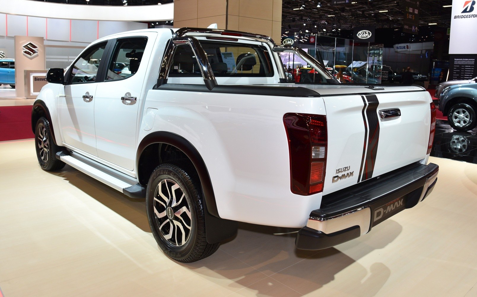 White pickup truck rear side with alloy wheels and sport bar