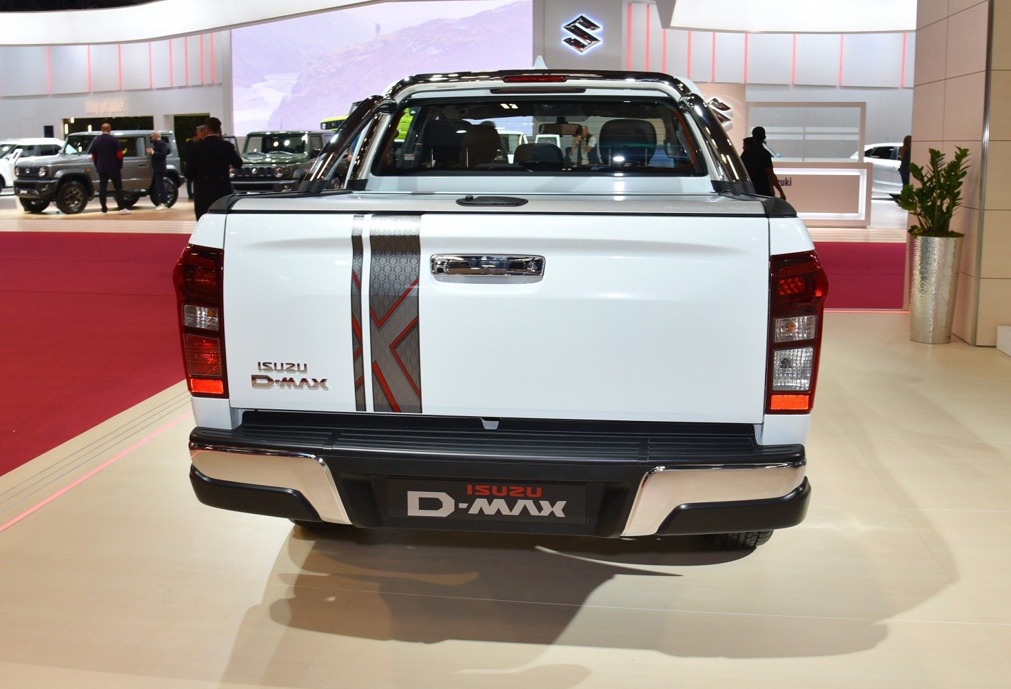Rear view of pickup tailgate with taillights and chrome details