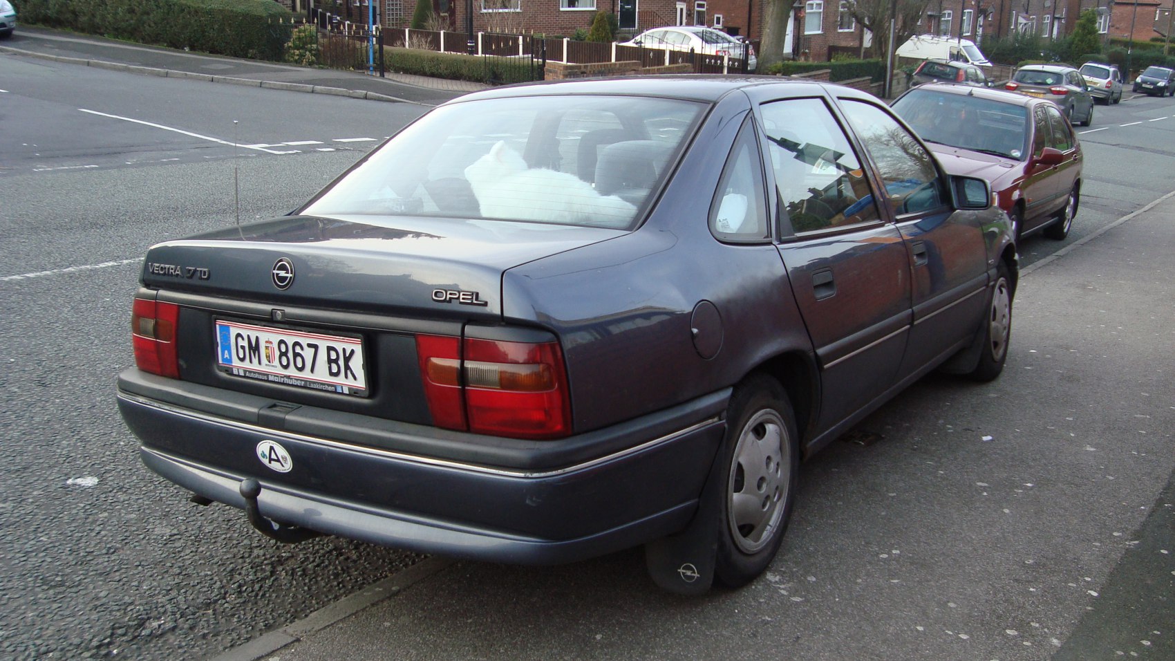 Rear view of a sedan with 1.7 D diesel badge and classic taillight design
