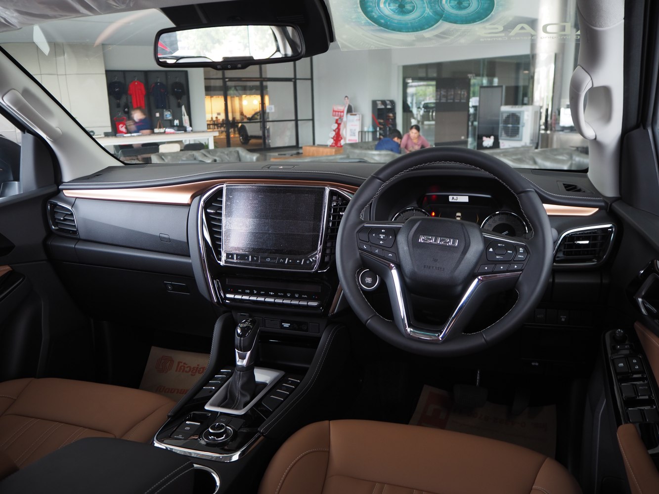 Modern dashboard and multifunction steering wheel in premium SUV interior