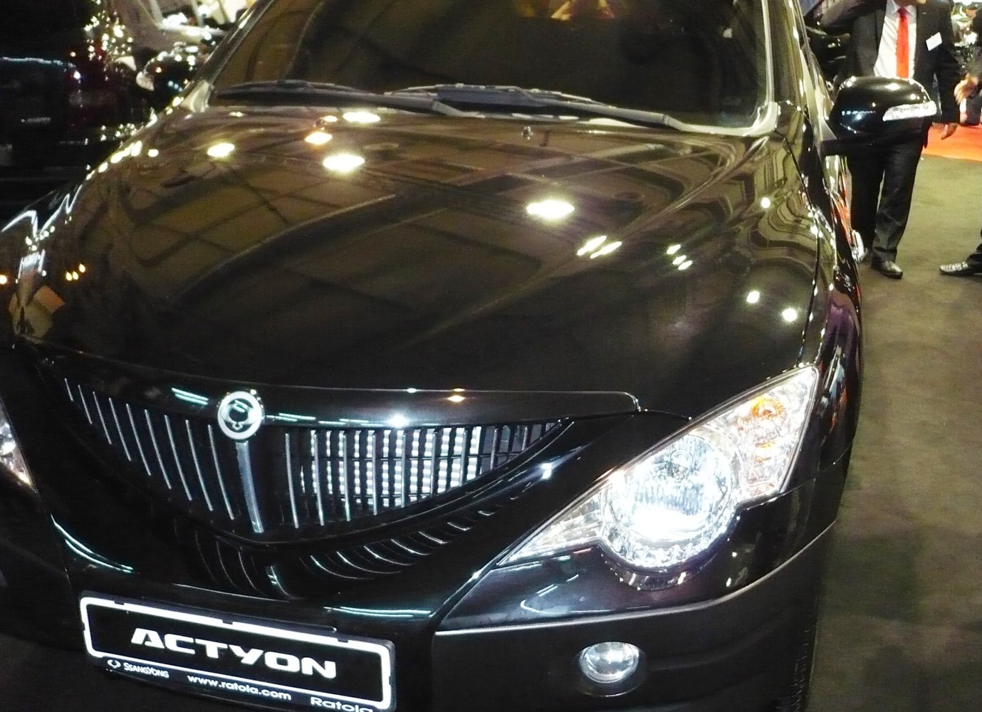 Front grille and headlights close-up with fog lights on a 2006 vehicle