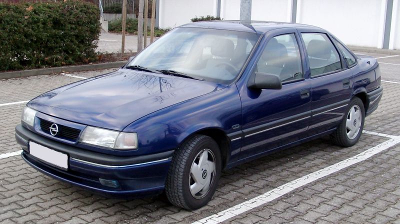 Blue four-door sedan with facelift front design and alloy wheels