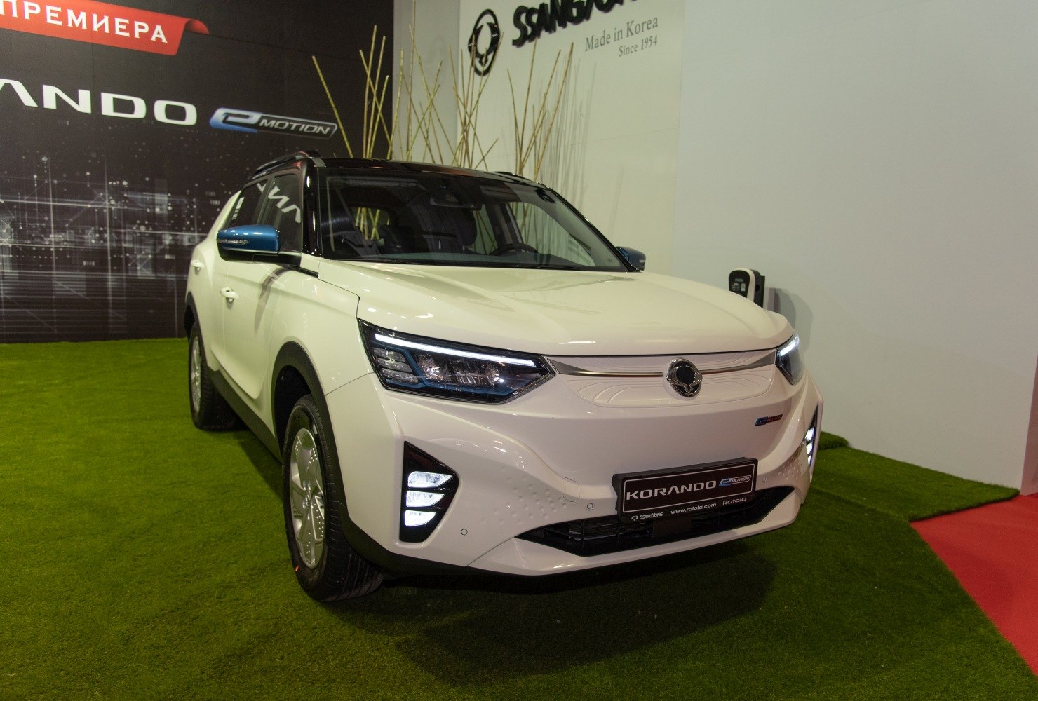 Front view of SUV with LED headlights and electric charging port