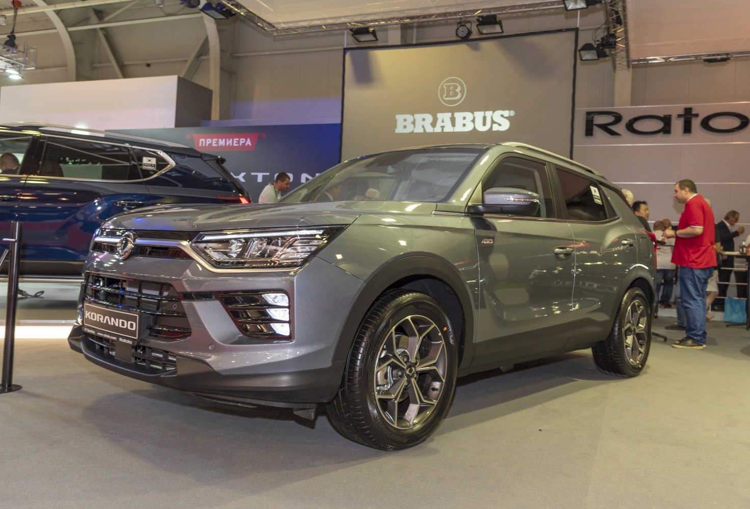Front side view of modern SUV with sleek headlights and alloy wheels