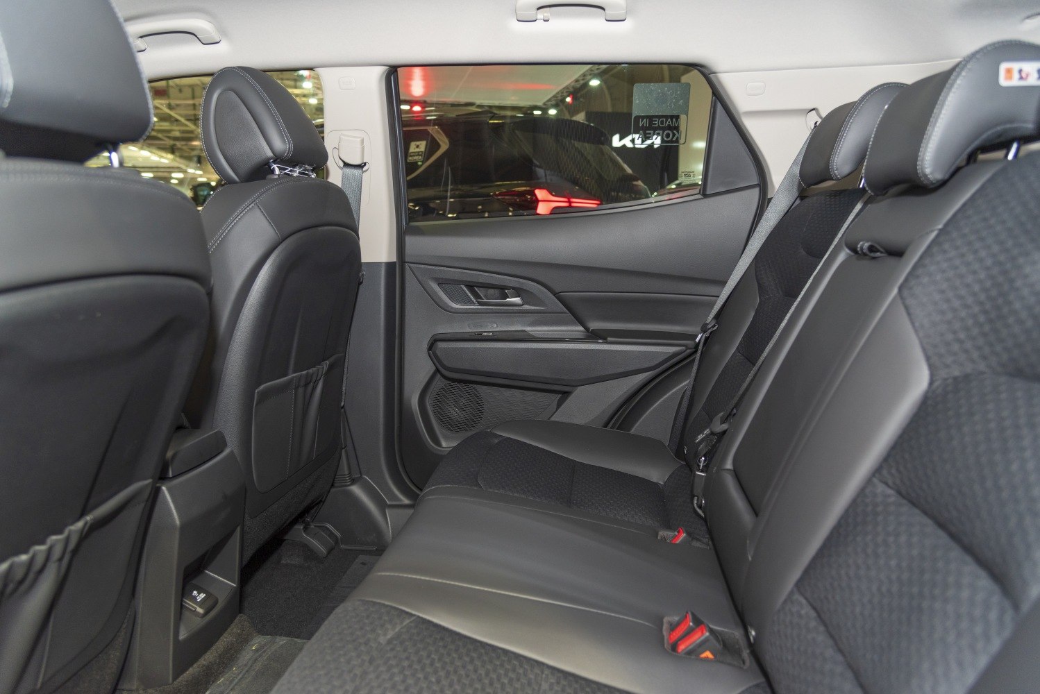 Rear interior seating with black upholstery and ergonomic design