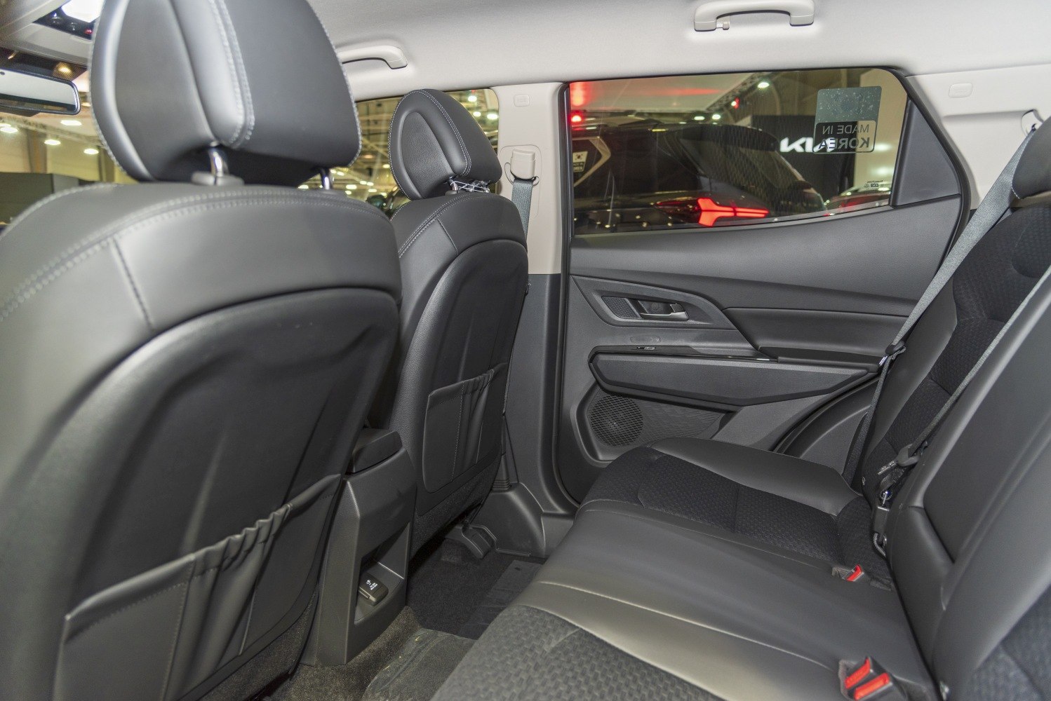 Rear seat interior with black upholstery and door panel