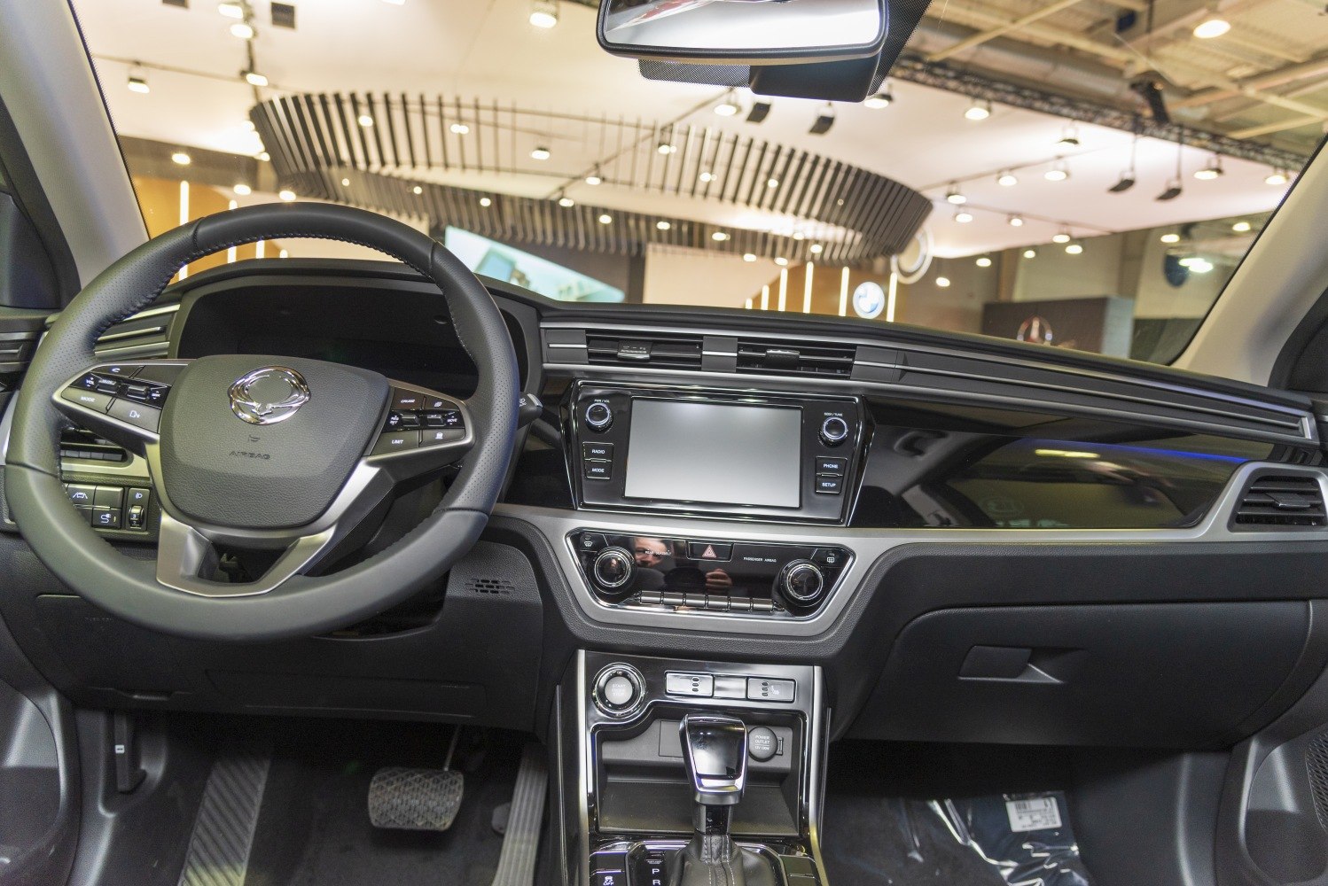 Steering wheel and center console with infotainment and controls