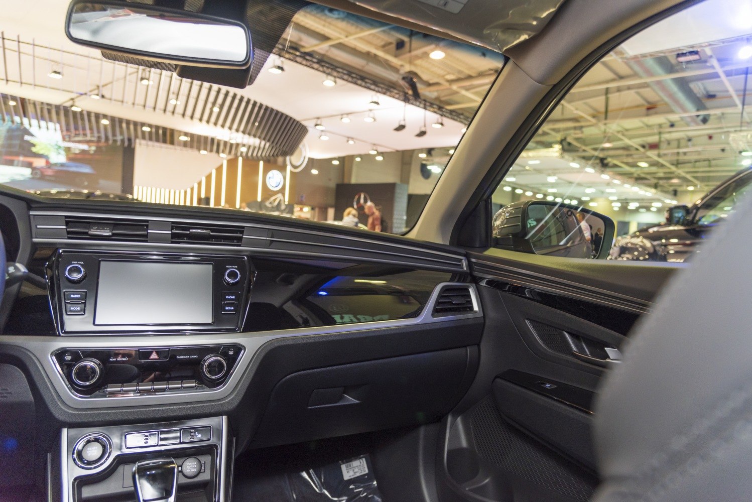 Modern car interior dashboard with touchscreen and multifunction controls