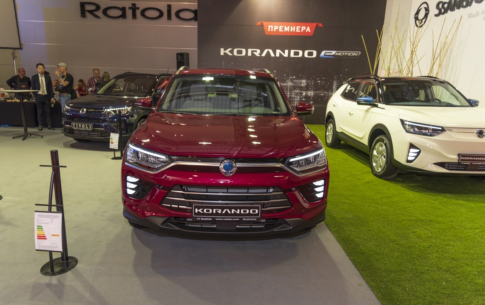 Red SUV front view with LED headlights and bold grille design.