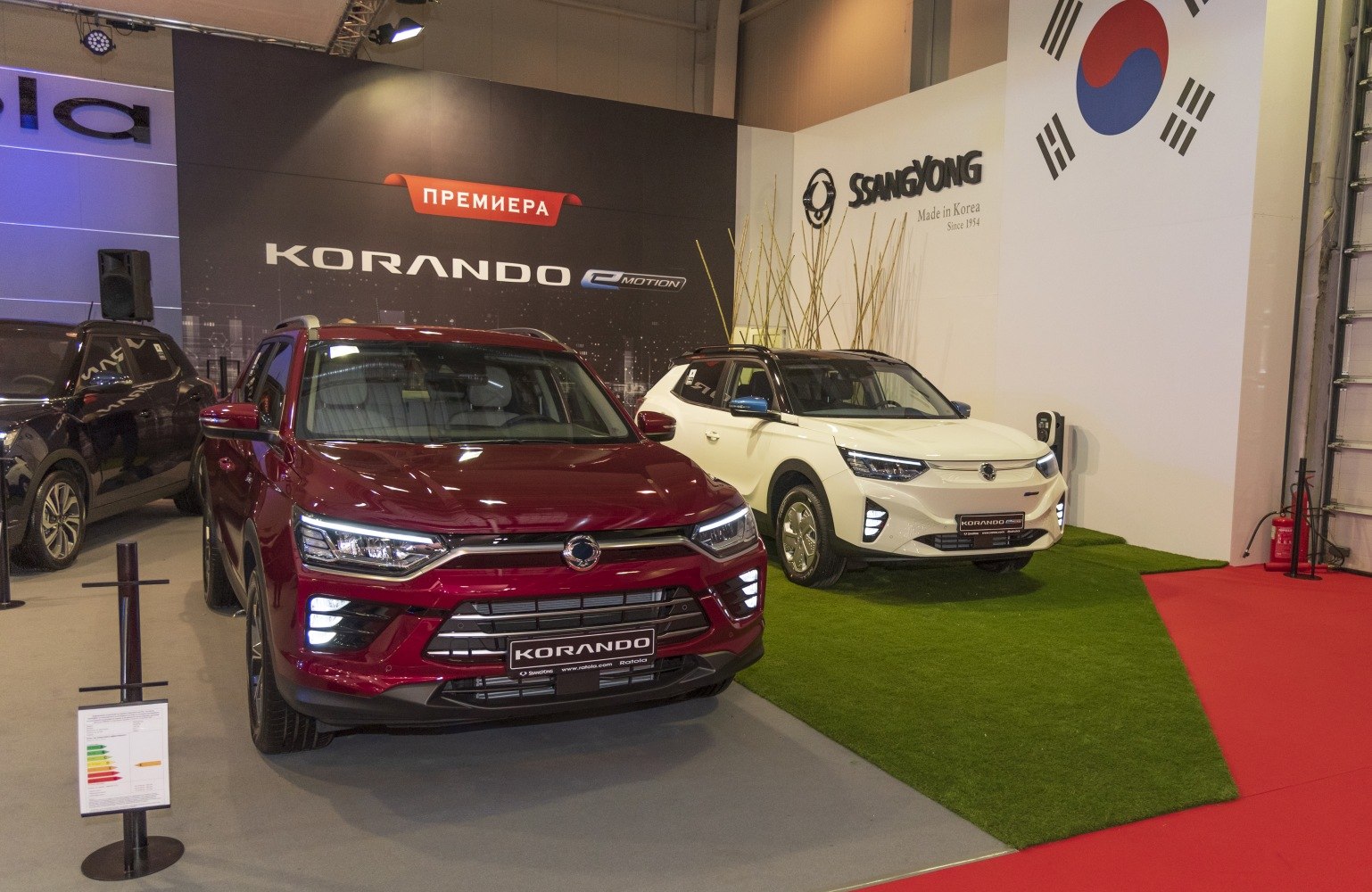 Front grille and electric model of SUV displayed indoors