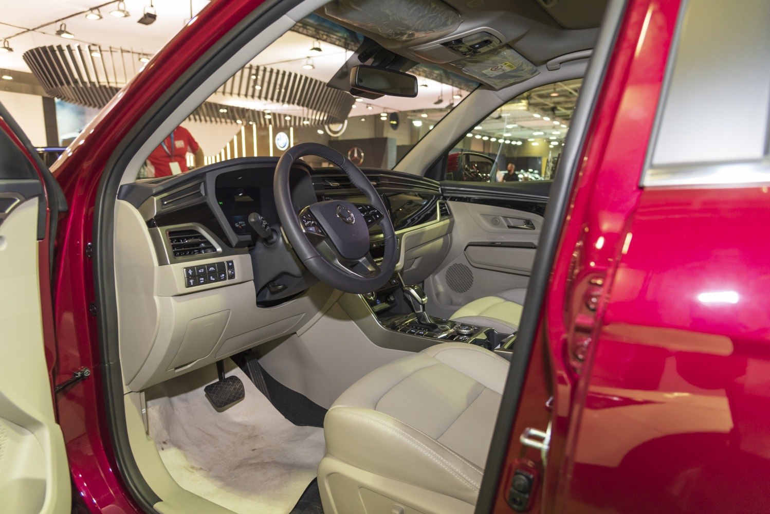 Modern car interior with steering wheel and dashboard controls