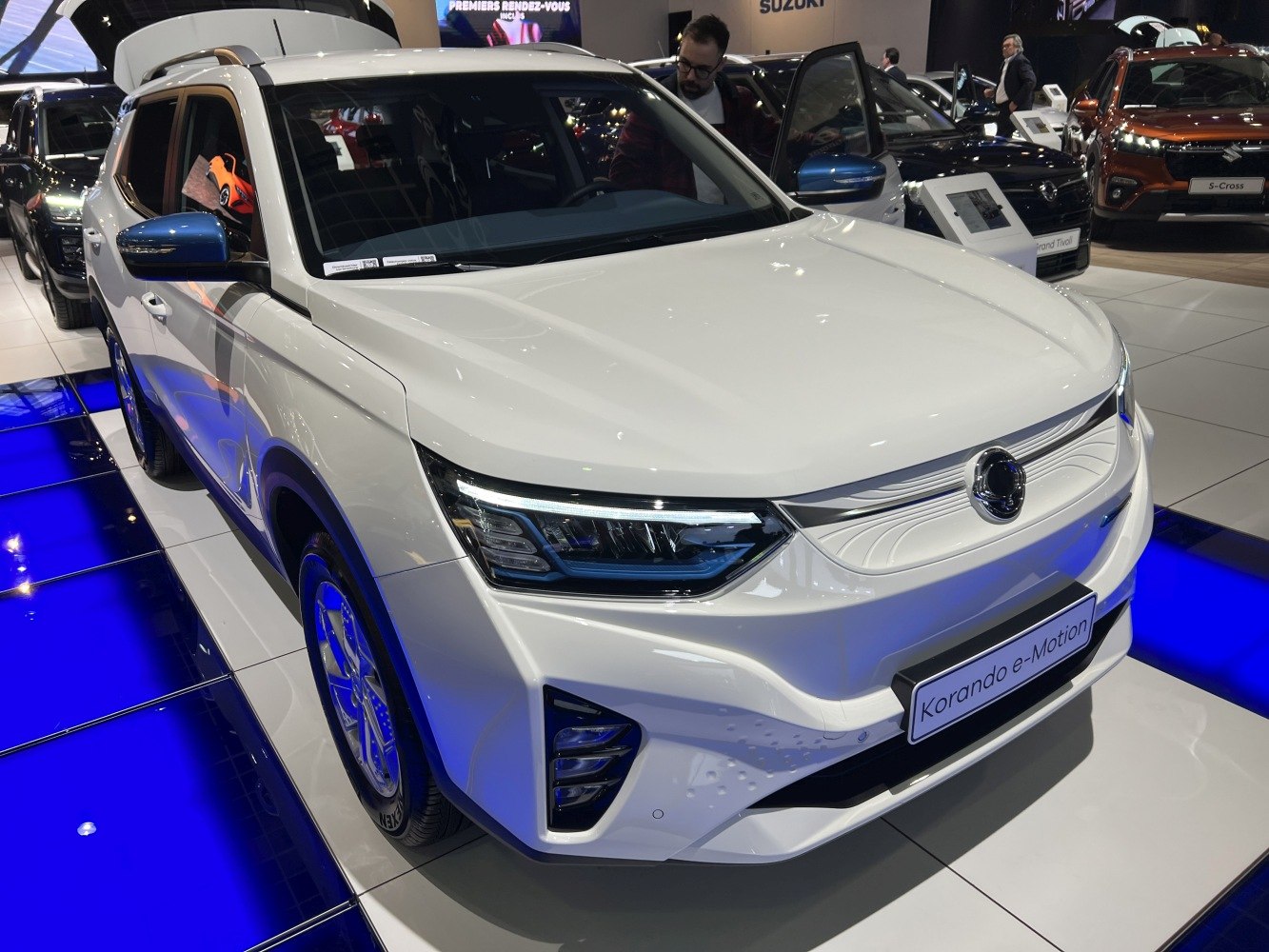 Front view of electric SUV with sleek LED headlights and modern grille design