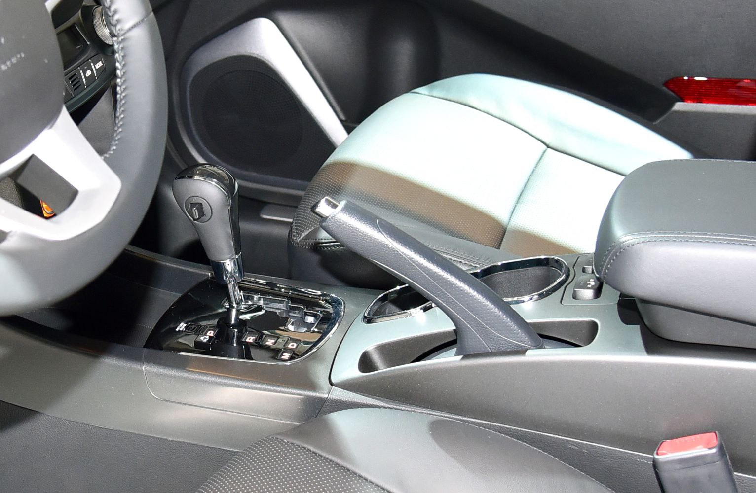 Automatic gear shift and handbrake lever in SUV interior center console
