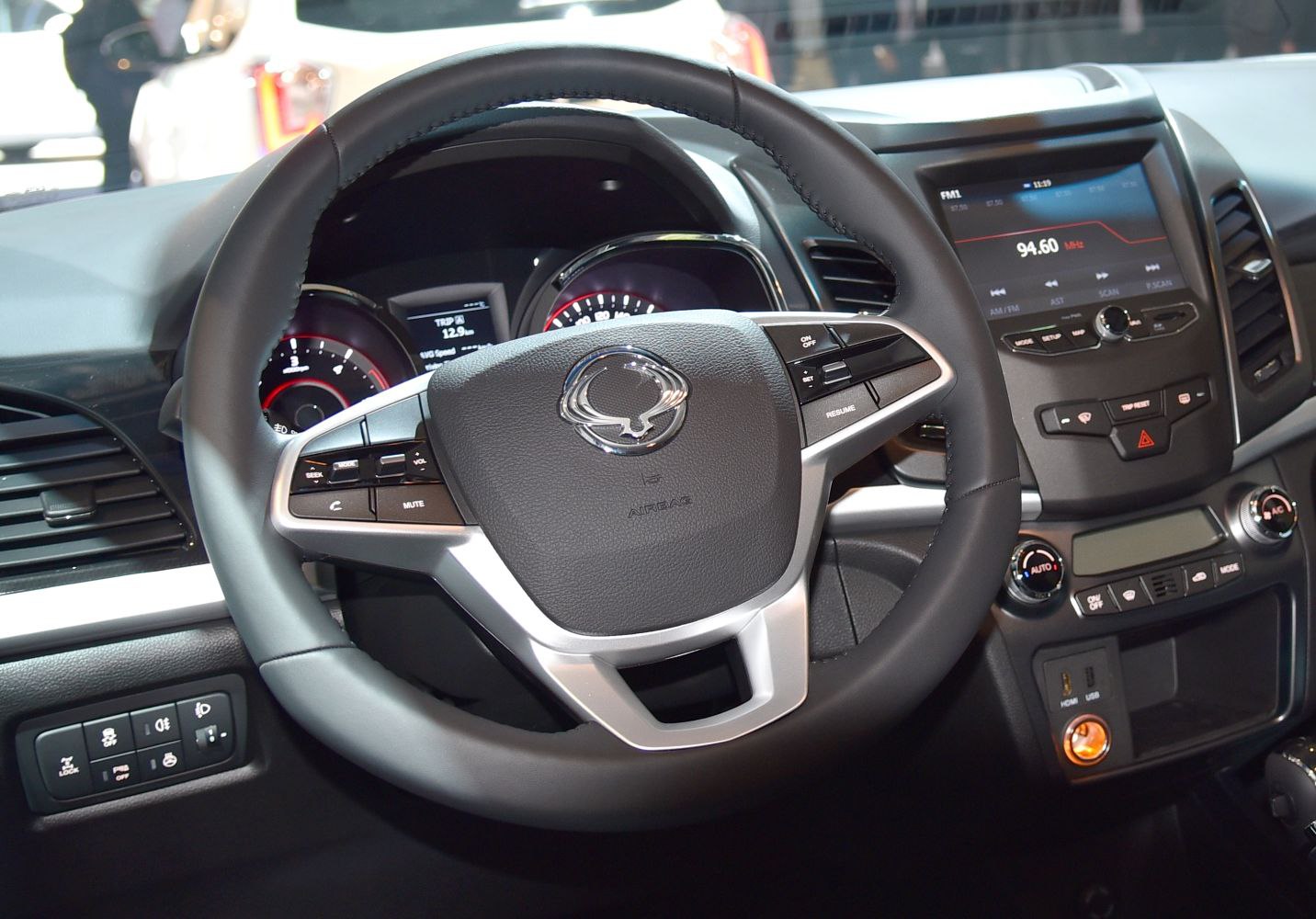 Steering wheel and dashboard with infotainment and controls