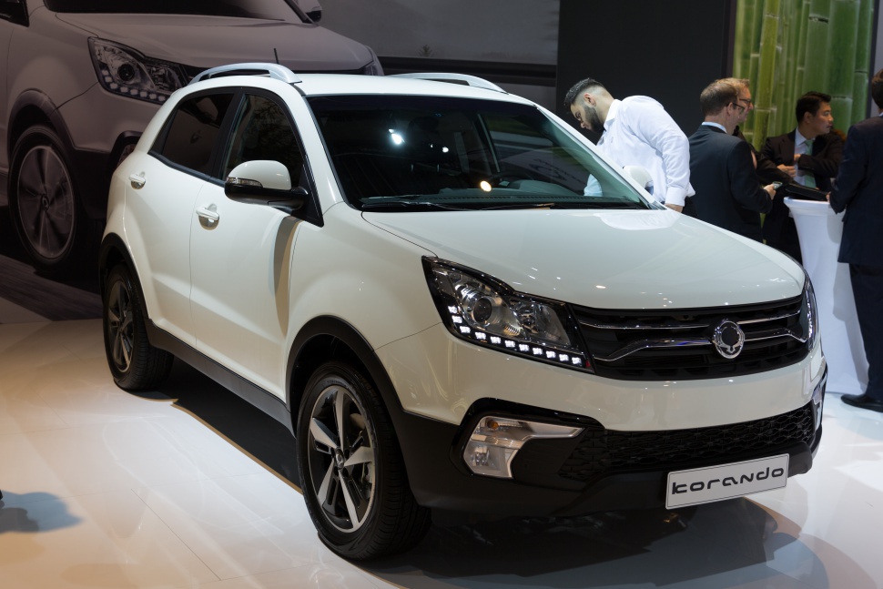 White SUV front side view with distinct headlights and grille