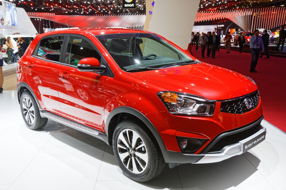 Red compact SUV with modern headlights and stylish alloy wheels