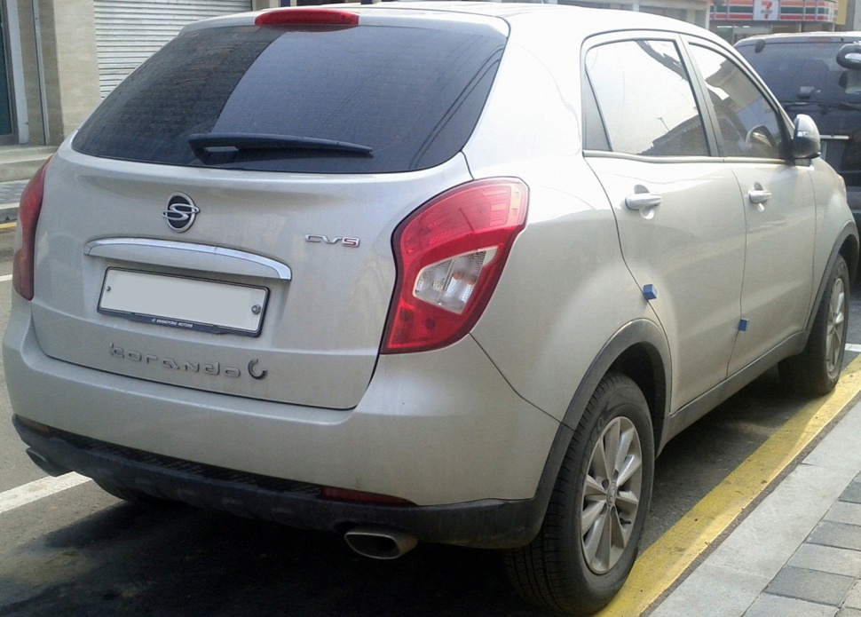 Rear exterior view with taillights, rear window, and exhaust