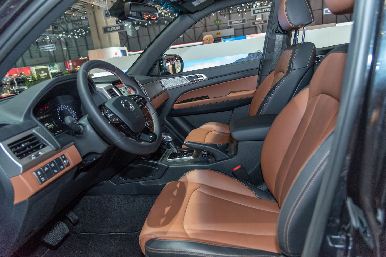 Luxury interior with brown leather upholstery and modern dashboard