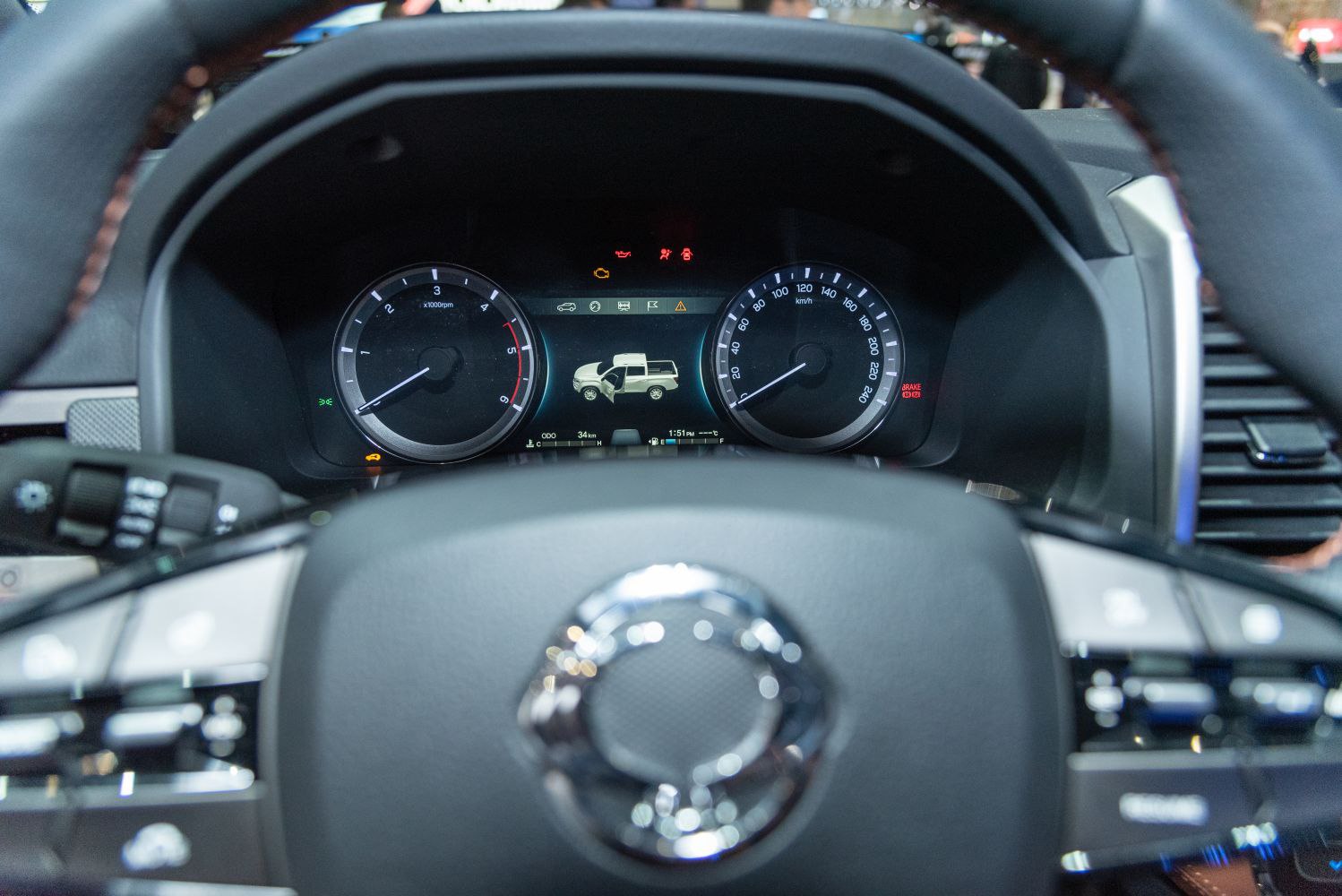 Dashboard with instrument cluster and steering wheel controls