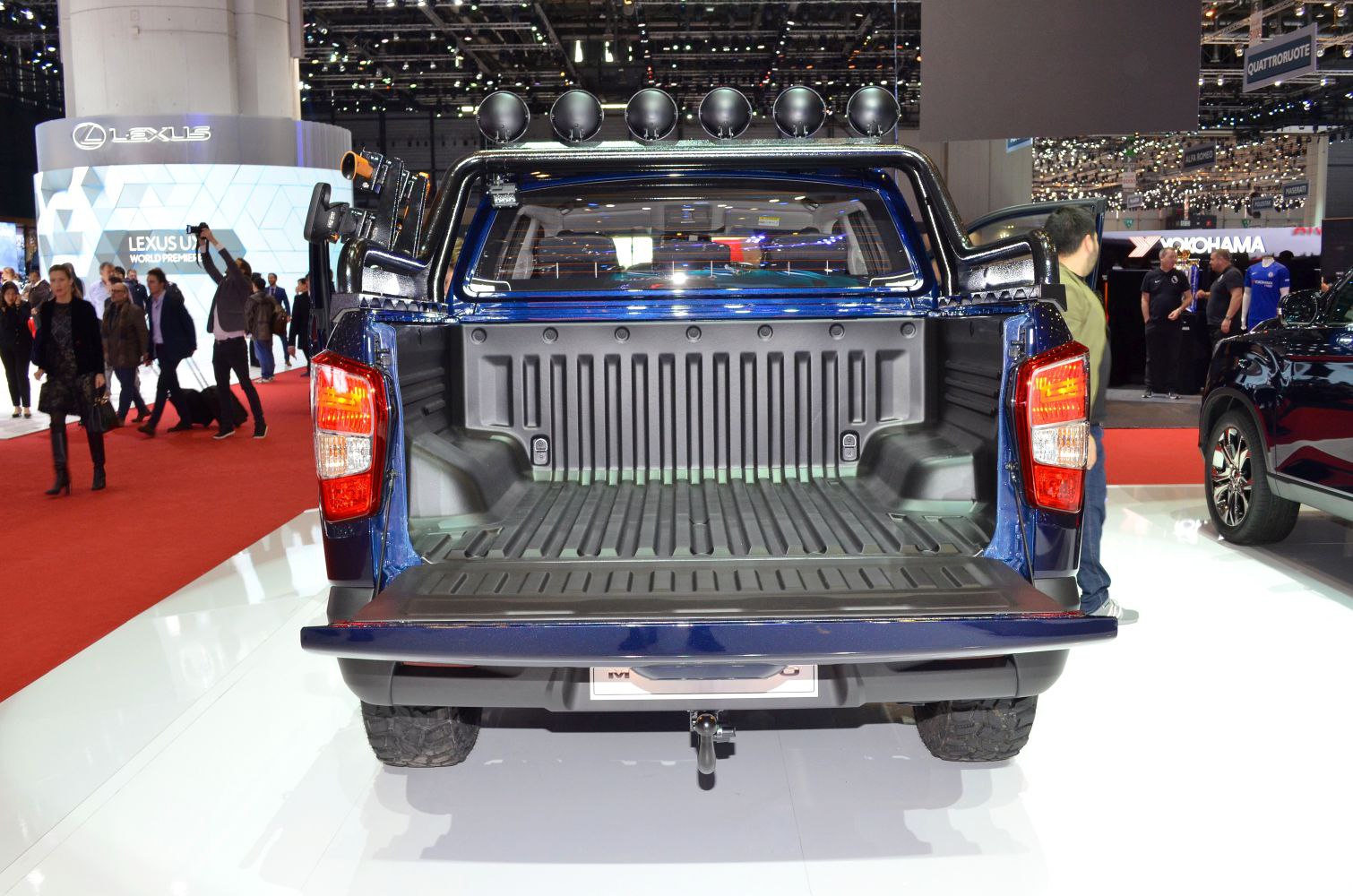 Open cargo bed with tailgate down and rear truck lights