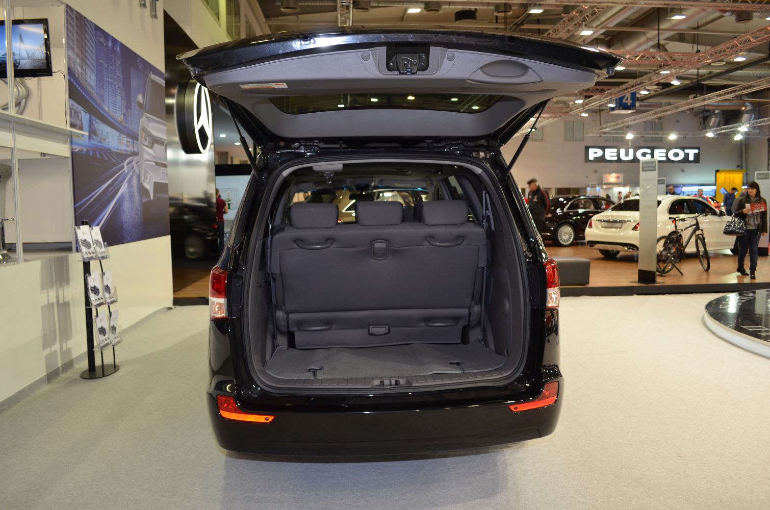 Open rear hatch showing third-row seats and cargo space