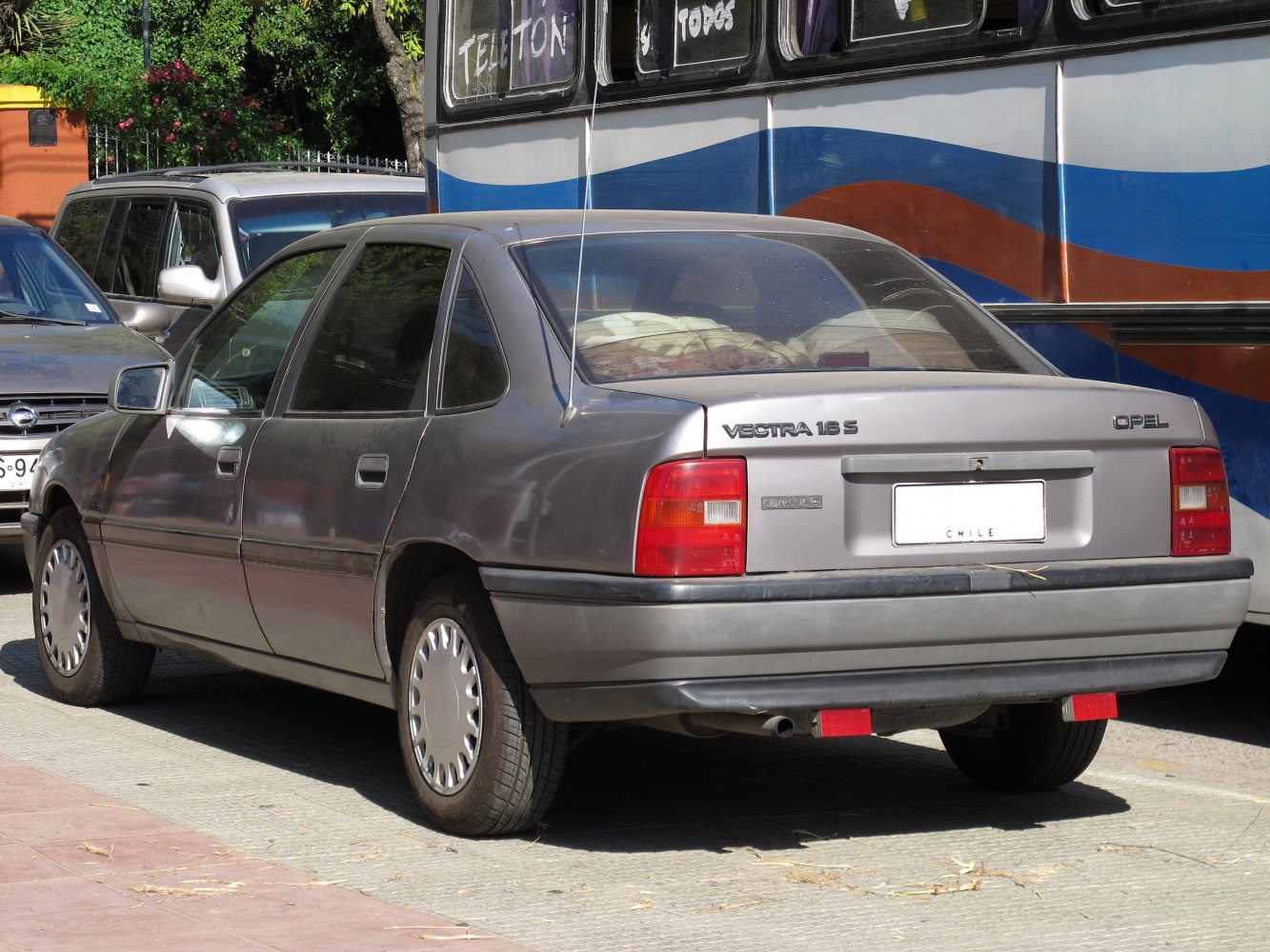 Rear side view of a classic hatchback with distinct taillights and original wheels.