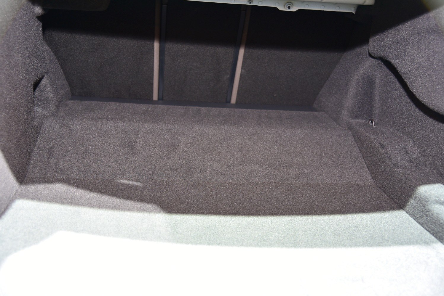 Spacious carpeted trunk interior with foldable rear seats space