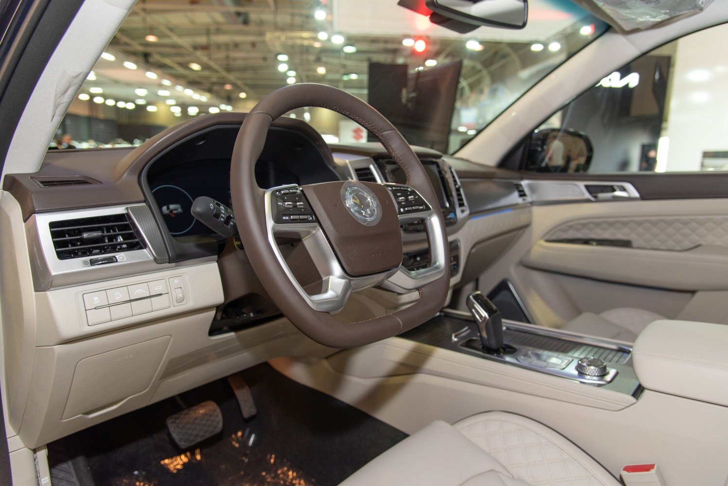 Luxury interior with modern steering wheel and quilted seats