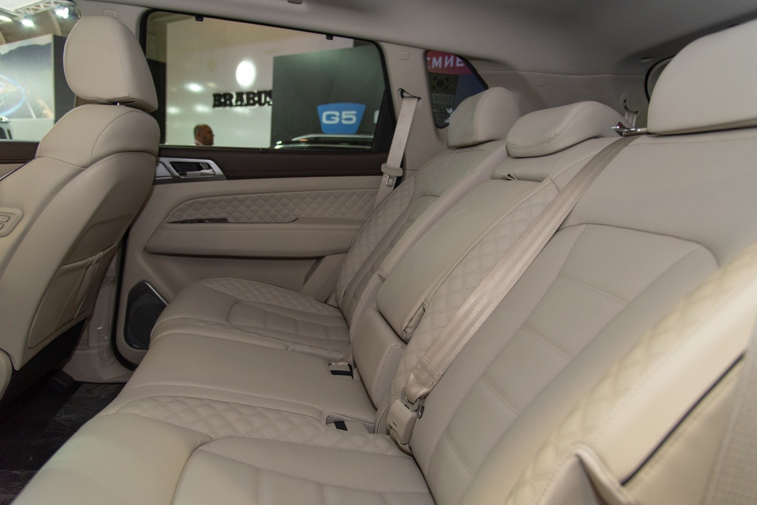 Beige quilted leather rear seats with premium upholstery design