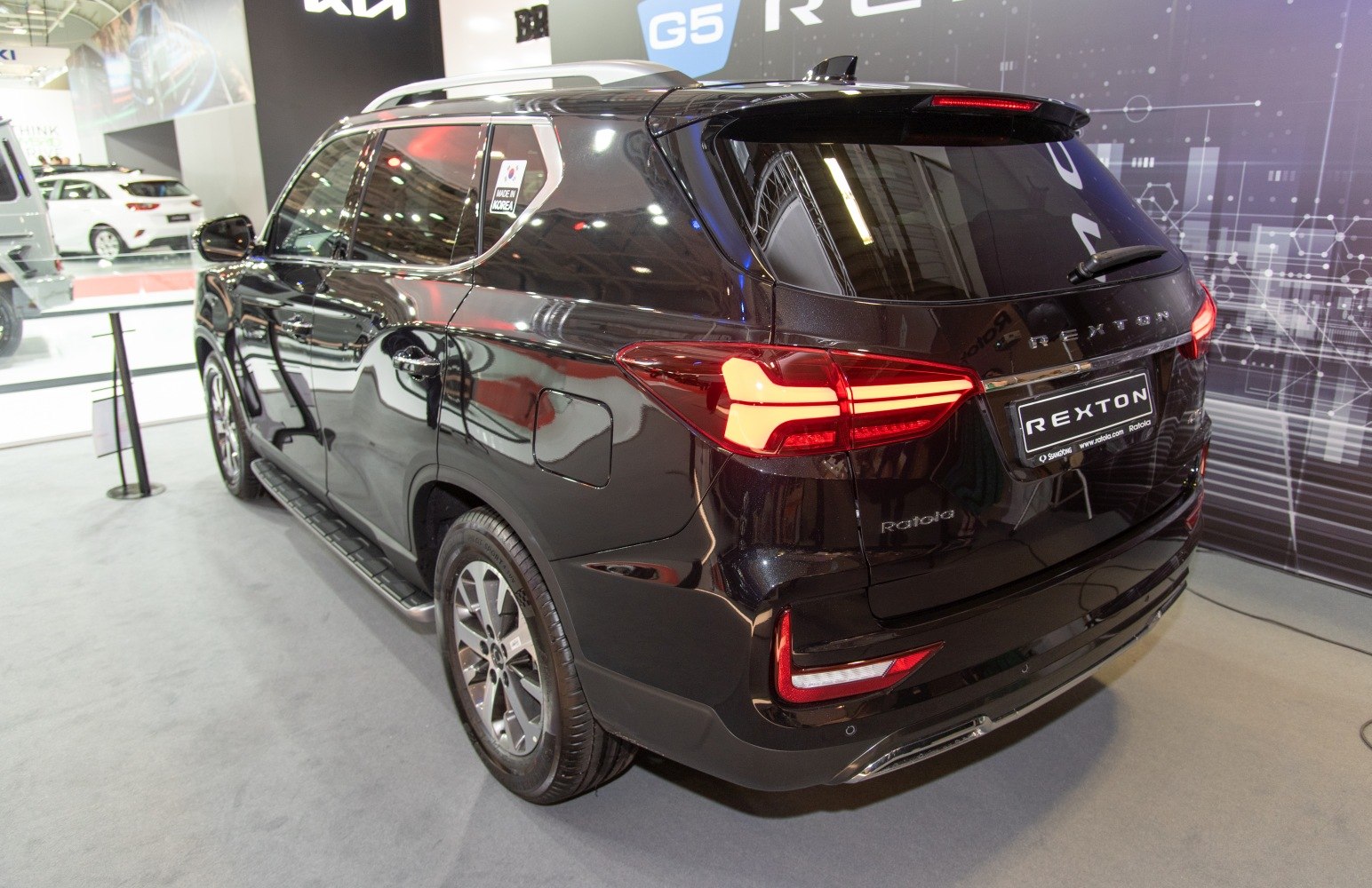 Rear and side view with distinctive taillights and sleek body design
