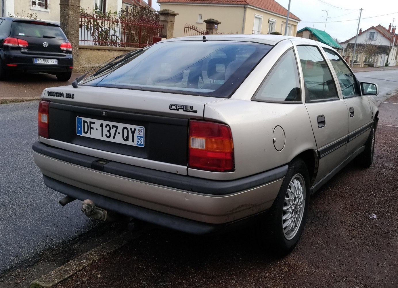 Rear and side view of classic hatchback with distinct tail lights and window design