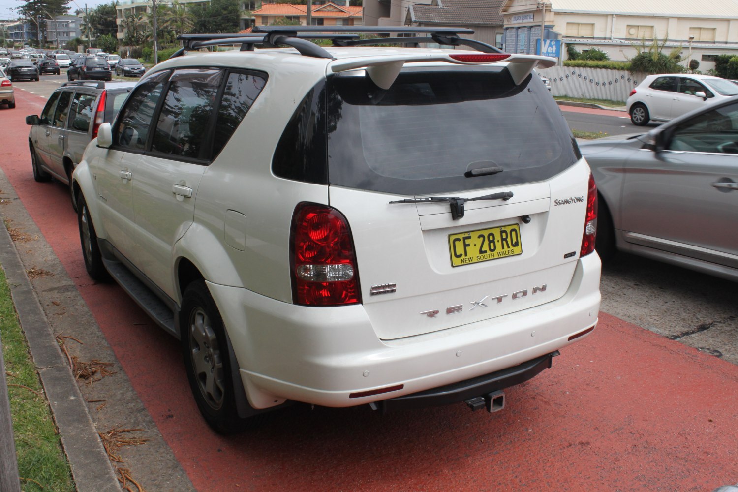 Rear view of SUV with roof rails and rear spoiler