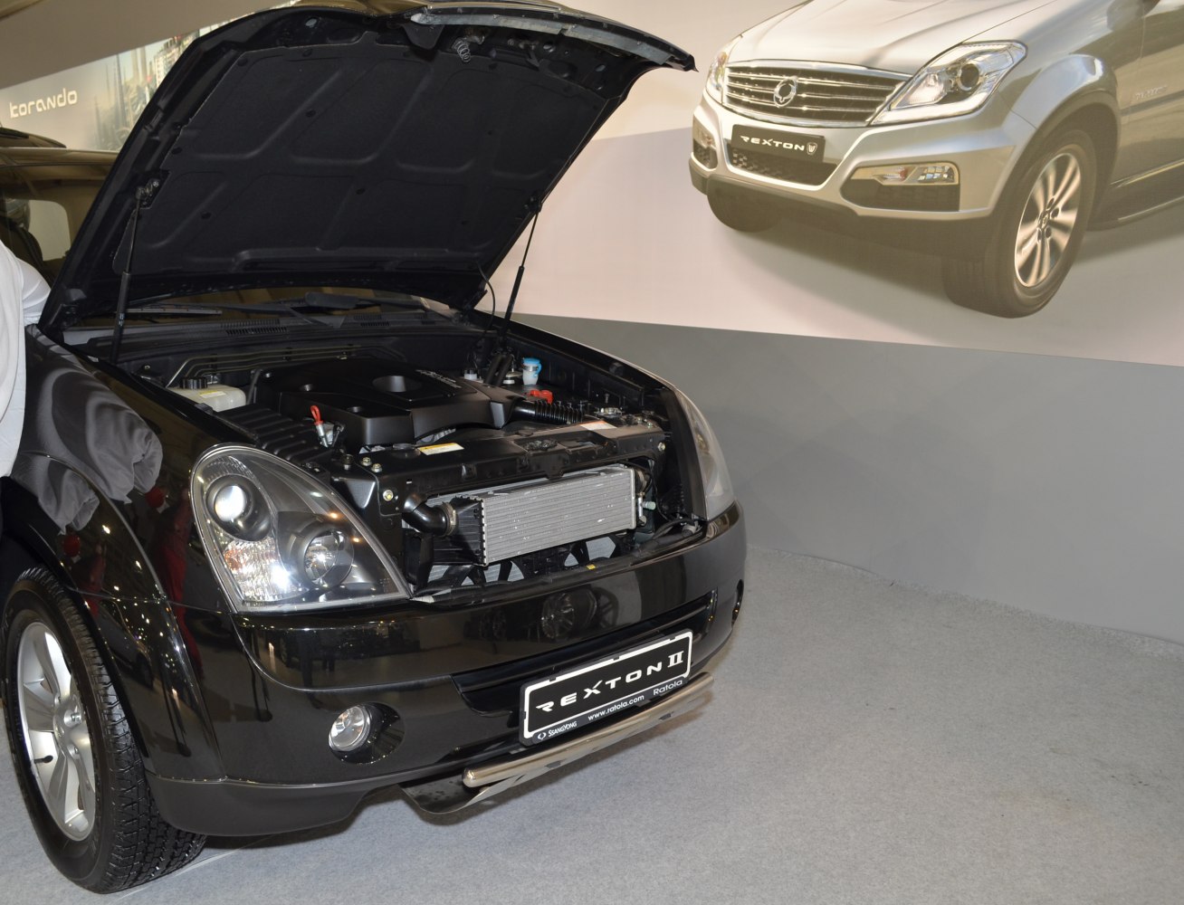 Front view with open hood showcasing engine bay and headlights