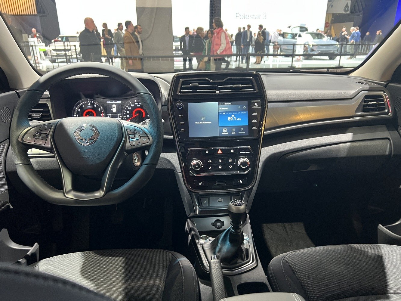 Dashboard and steering wheel with infotainment and manual gear shift