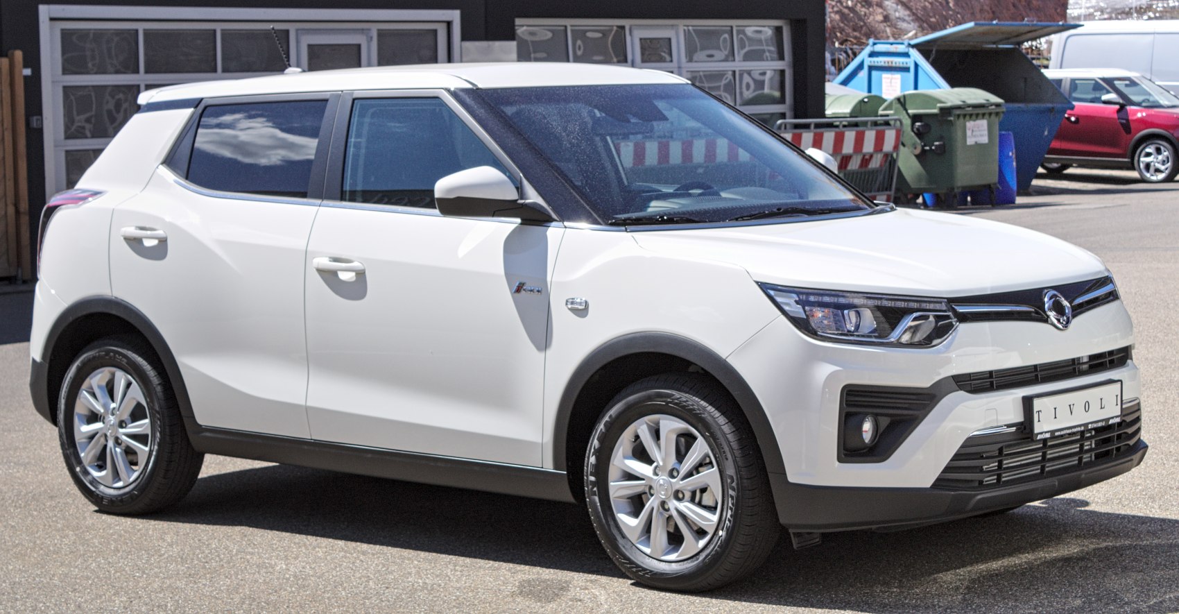 White compact SUV side and front view with alloy wheels and modern headlights