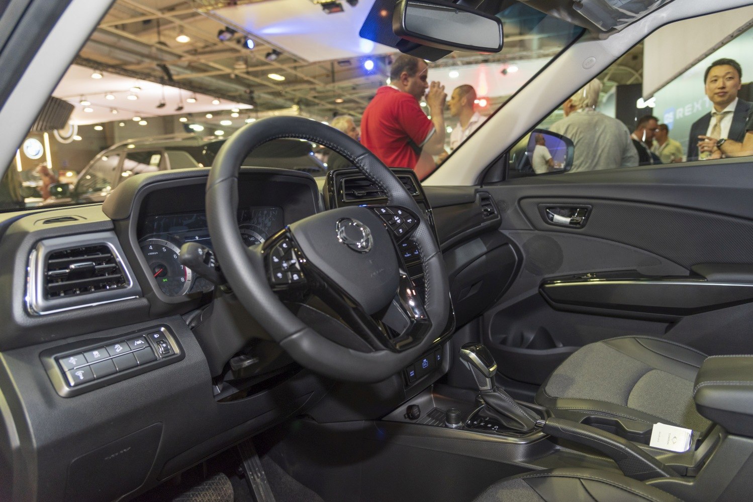 Steering wheel and dashboard interior design with automatic gear shift.